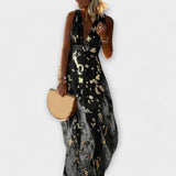 Vestido fluido com decote em V e detalhes em paetês